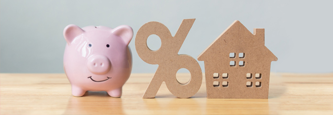 Piggy bank, percent sign indicating Interest rate and small model of a house.